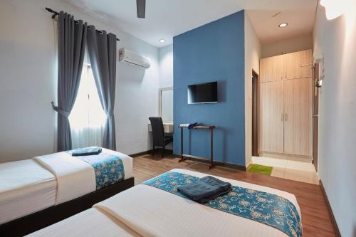 D' Qamar Guesthouseにあるベッド