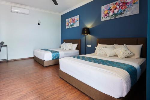 D' Qamar Guesthouseにあるベッド