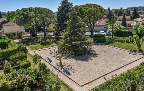 an overhead view of a park with a tree and benches at Nice Apartment In Carpentras With Wifi in Carpentras