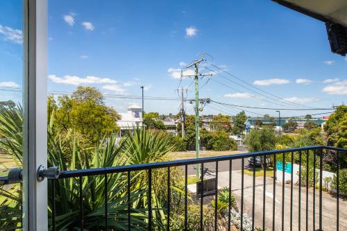 a balcony with a view of a street at The Mulgrave Motel in Mulgrave