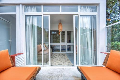 an open living room with sliding glass doors at Signature Agadir Villa Luxe for 4 or 6 PX in Agadir