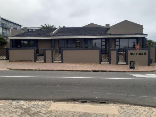 a house on the side of a street with a road at CBS Accommodation in Mossel Bay