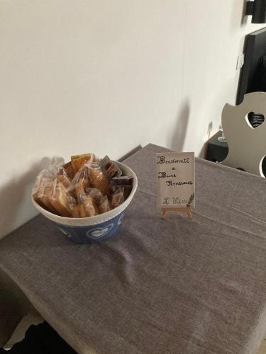 a bowl of food sitting on a table with a sign at L’Ulivo in Formia
