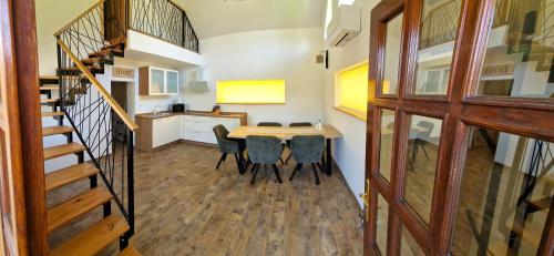 a kitchen and dining room with a table and chairs at Bled Straza House in Bled