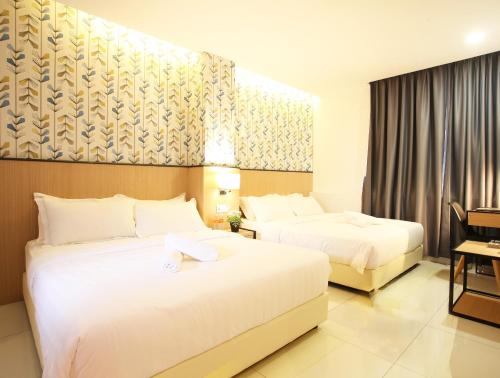 Säng eller sängar i ett rum på Sovotel @ Kota Damansara 8