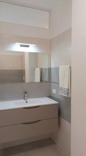 a bathroom with a sink and a mirror at G_Open space in Porto SantʼElpidio