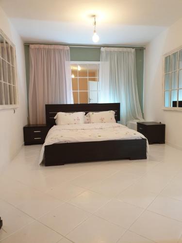 a bedroom with a large bed in a room at HOUSE SUITES DOMAINE in Rizómilos