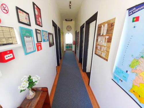 a hallway in a school with a long hallway at Meraki Hostel in Sintra