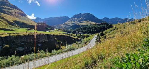 a road in a valley with mountains in the background at Curtinfess Franklin in Bivio