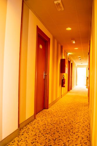 a hallway of an office building with a hallwayngth at eco Hotel Milano & BioRiso Restaurant in Milan