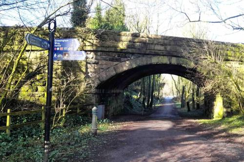 an old stone bridge over a dirt road at The CowShed Cottage - Beautiful Location in Lancaster