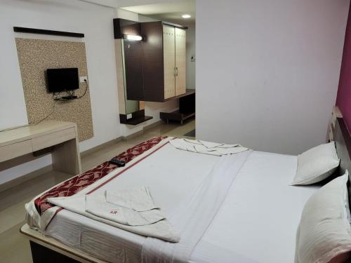 Postel nebo postele na pokoji v ubytování Sandesh Resort