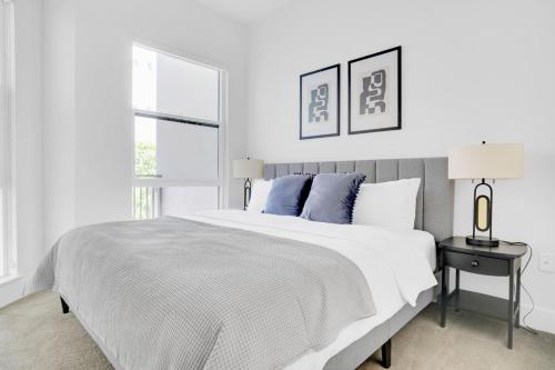 a white bedroom with a large bed and a window at Redwood City 1BR w Roof Gym WD nr Caltrain SFO-959 in Redwood City