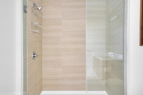 a bathroom with a shower with a glass door at Redwood City 1BR w Roof Gym WD nr Caltrain SFO-959 in Redwood City