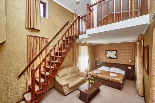 a hotel room with a bed and a staircase at Royal Street Hotel in Odesa