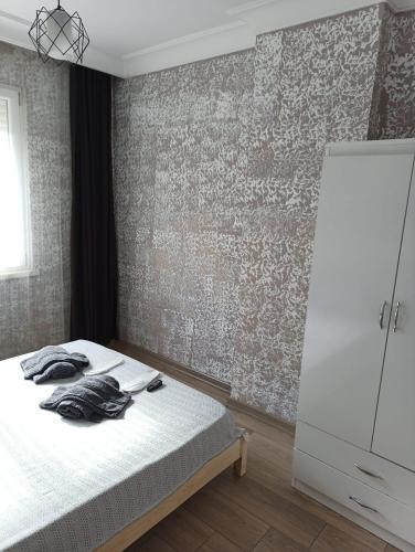 Кровать или кровати в номере Konyaaltı Tunç Apart