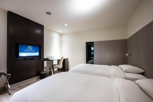 Hotel Bonzaにあるベッド