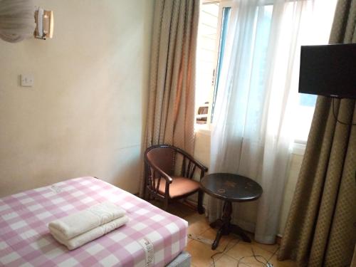Ένα ή περισσότερα κρεβάτια σε δωμάτιο στο DOUBLE FIVE HOTEL