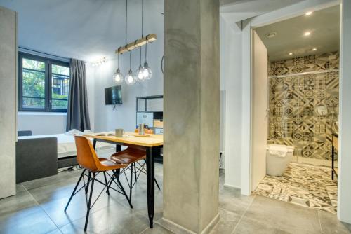 a kitchen and dining room with a table and chairs at Italianflat - Angolino dei navigli in Milan