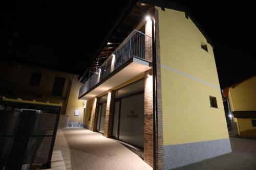 a building with a staircase on the side of it at night at Villoresi Rooms in Castano Primo