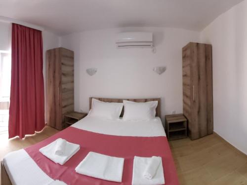 Een bed of bedden in een kamer bij Vila Aren