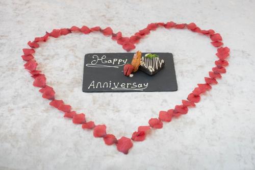 a heart with a happy anniversary sign on it at RainHill Hall Hotel in Rainhull