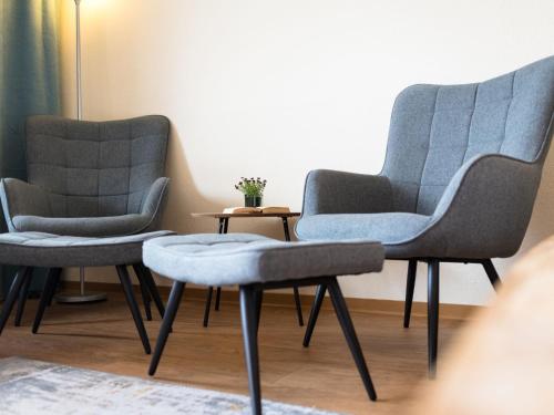 two chairs and a table in a room at Apartment B907 by Interhome in Lahnstein