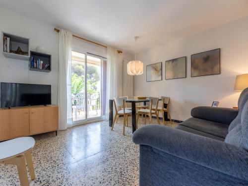 a living room with a couch and a table at Apartment Mas Baixuli by Interhome in Tarragona