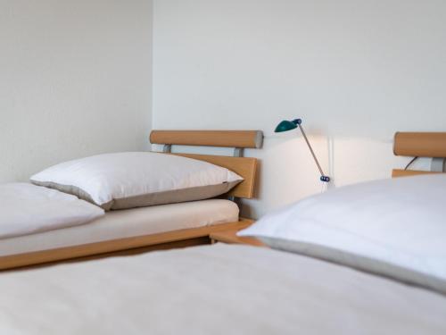 two beds sitting next to each other in a room at Apartment B512 by Interhome in Lahnstein