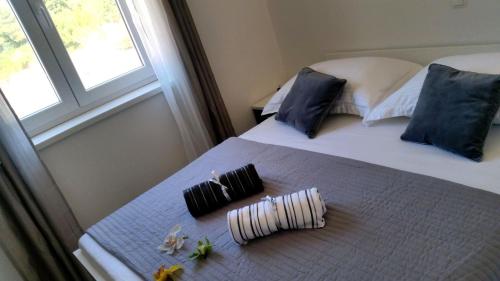 Ένα ή περισσότερα κρεβάτια σε δωμάτιο στο Apartments Sea Reflections