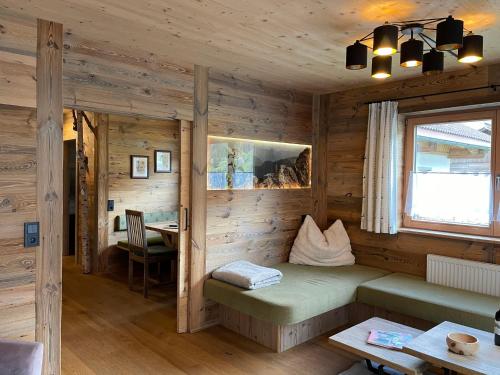 a room with a bed in a wooden cabin at Apartment Eberharter-5 by Interhome in Aschau