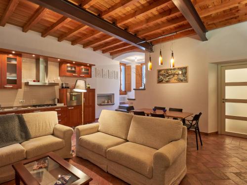 a living room with a couch and a table at Holiday Home La Cascina by Interhome in Lierna