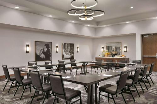 a conference room with a table and chairs at Hyatt Place Fort Worth/TCU in Fort Worth