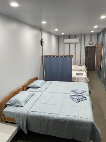 a bedroom with a large bed in a room at Hunny Home in Ko Yao Noi