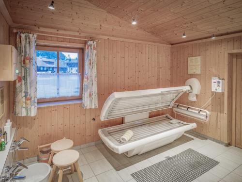 a hospital room with a bed and a sink at Gästehaus Elfriede in Haldensee