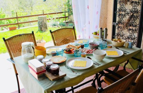 a table with plates of food on it at La Colombaia Amiata in Arcidosso