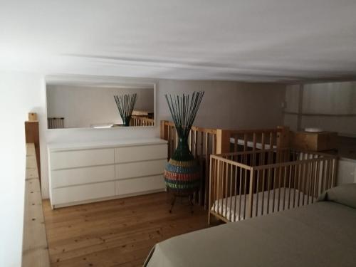 a bedroom with a bed and a vase in a room at Ute Hotel in Lido di Jesolo