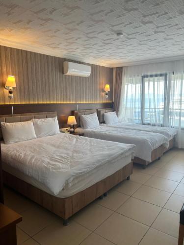 Una cama o camas en una habitación de Hotel Stella