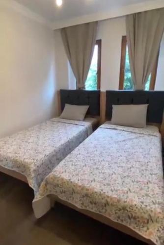 Postel nebo postele na pokoji v ubytování Karabak Villa