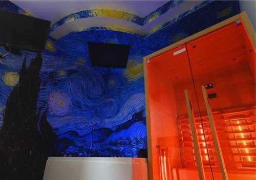 a room with a painting on the wall at ARTEMIDE "Fiore Club" B&B SUITE SPA in Giffoni Valle Piana