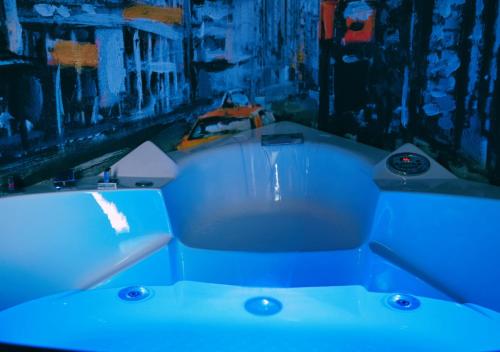 a blue bath tub sitting in a room at ARTEMIDE "Fiore Club" B&B SUITE SPA in Giffoni Valle Piana