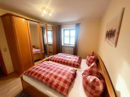a room with two beds in a room at Mesnerhof in Bayerbach