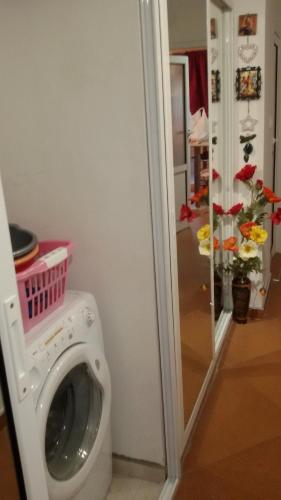 a washing machine with a basket on top of it at Katties nice studio in Stara Zagora