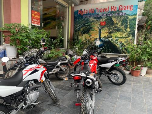 a group of motorcycles parked in front of a building at Ngan Ha Homestay in Ha Giang