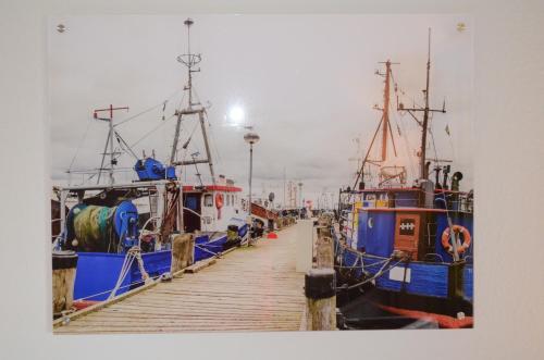a group of boats parked next to a dock at Mare Balticum Urlaub auf Rügen in Sagard