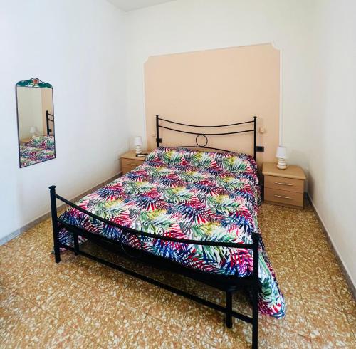 Cama ou camas em um quarto em A casa di Mario e Nenè