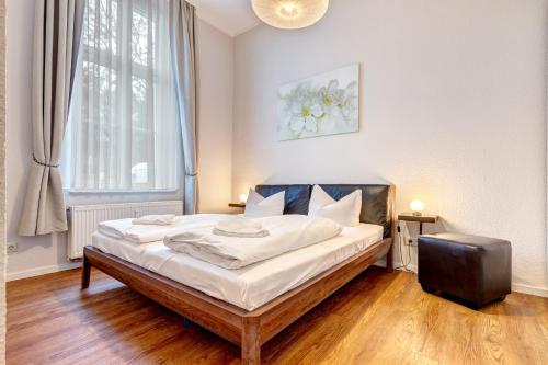 Кровать или кровати в номере Villa Anna Wohnung Bernstein