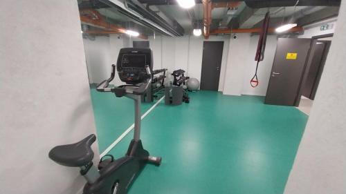 a gym with an exercise bike and a treadmill at Jazz Apartment in Budapest