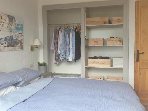 a bedroom with a bed and a closet at Ibiza in Begur