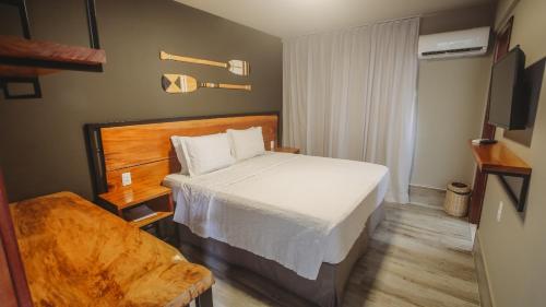 Кровать или кровати в номере Pousada Pérola Do Morro